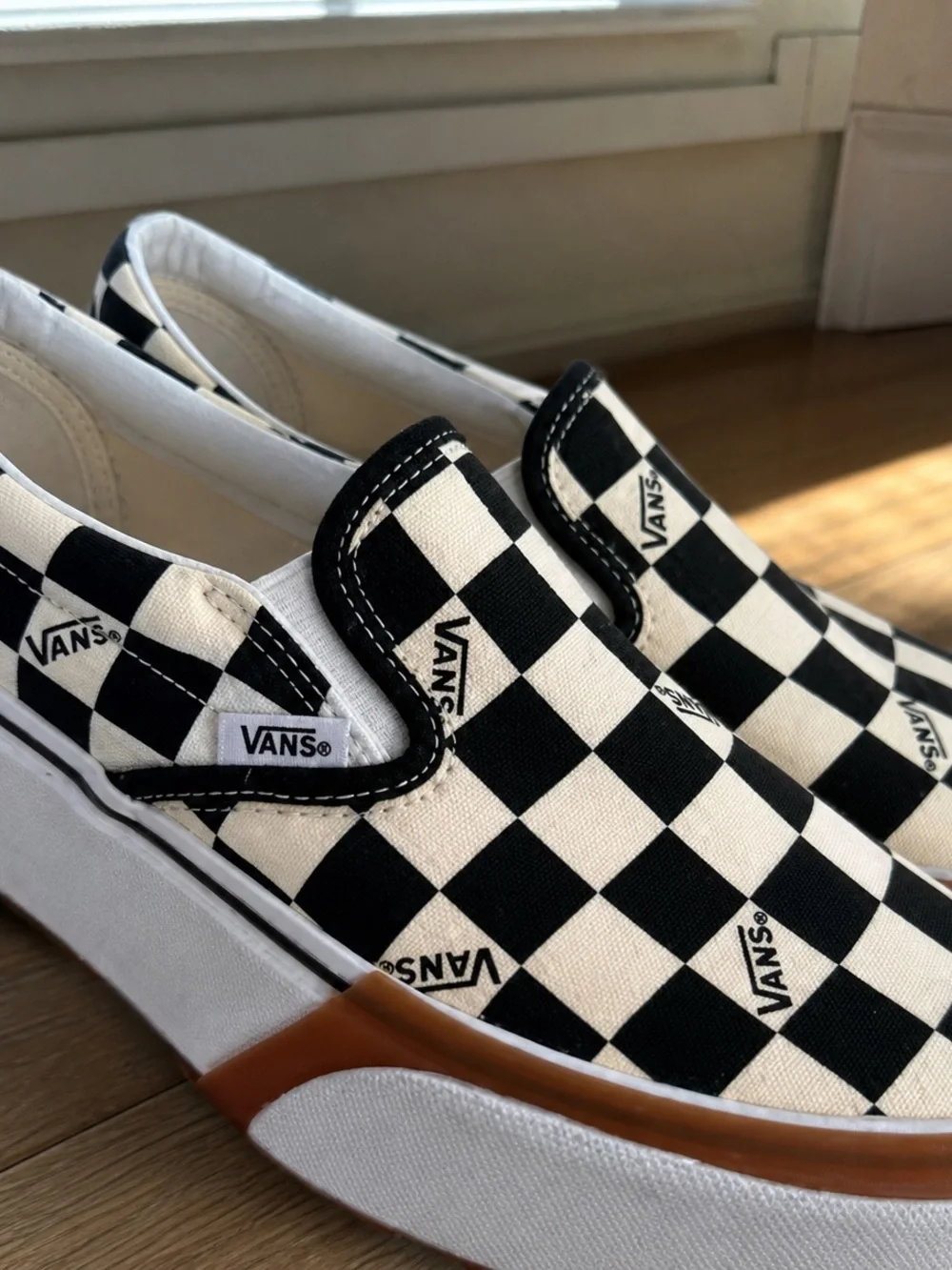 Vans Checkerboard Slip-On Sneakers in Black and White